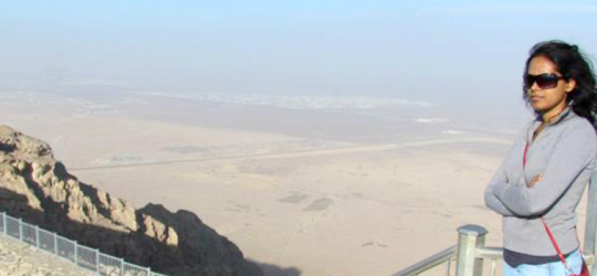 Banner image of Rebecca Rodrigues visiting desert mountain overlook